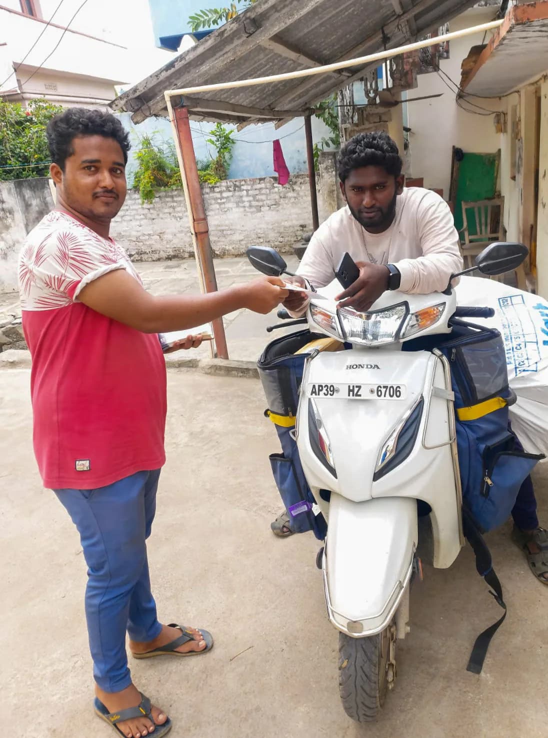 A scooter handed over outside the church as part of its community work