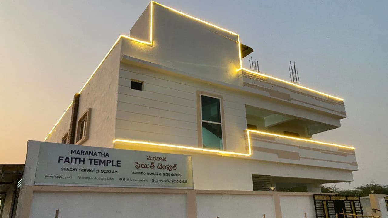 The Maranatha Faith Temple building by day, its name board above the entrance