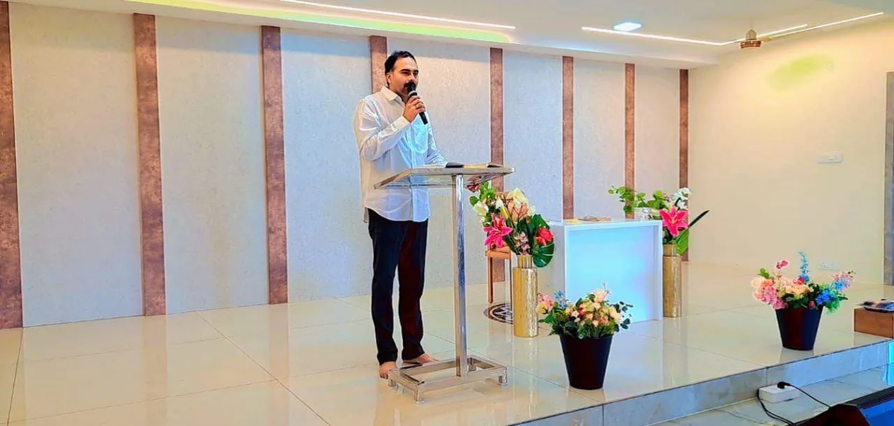 Pastor Sridhar preaching at Faith Temple